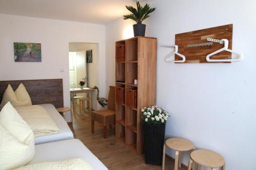 a living room with a couch and a table at Easy Stay Apartment in Oberboihingen