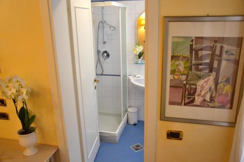 a bathroom with a shower and a toilet and a sink at Residenza Favaro in Venice