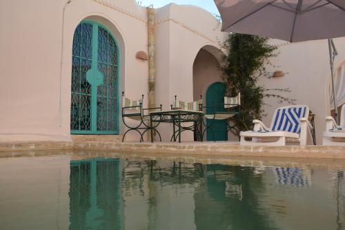 The swimming pool at or close to Dar Lily