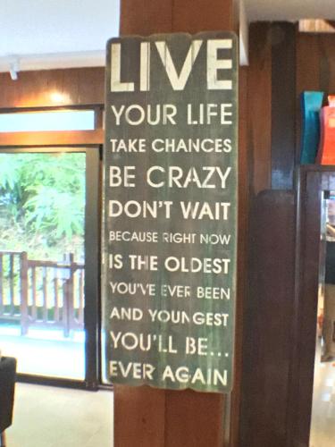 a sign on the door of a restaurant at Kairos Villa in Seremban