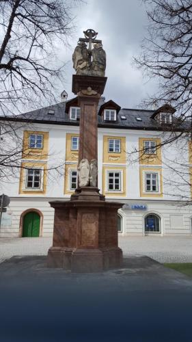 a fountain in front of a building with a building at Feine Herbergen Maria Magdelena in Bad Aussee
