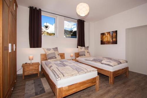 Postel nebo postele na pokoji v ubytování Ferienwohnungen Vollmers-Dünnebacke