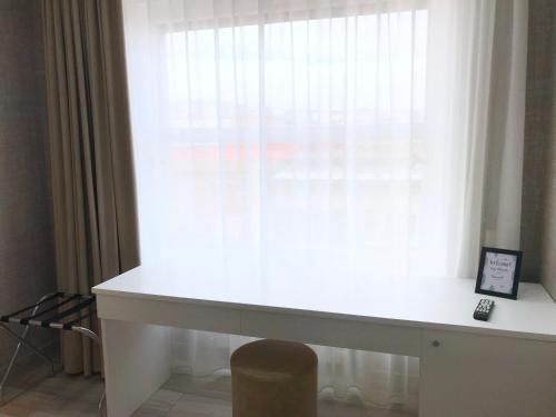 a white desk in front of a window at BRAKKO 45 in Naples