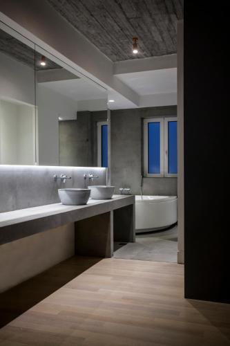 Katil atau katil-katil dalam bilik di Art Suites Korai