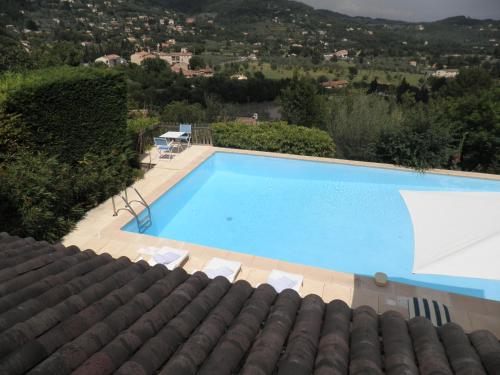 a swimming pool in a villa with a view at Villa Magnolia in Seillans