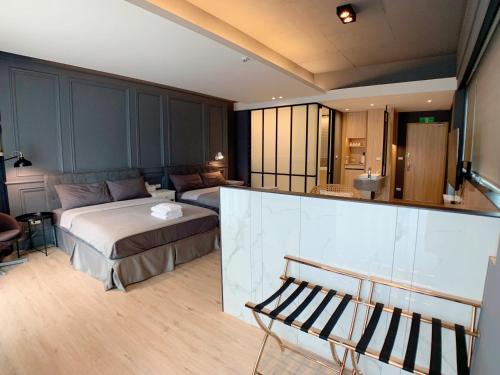 a bedroom with a bed and a living room at 台南圈旅 in Tainan