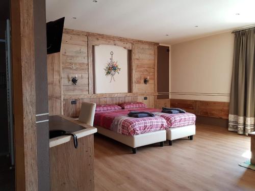 Кровать или кровати в номере La Grolla Rooms & Apartments