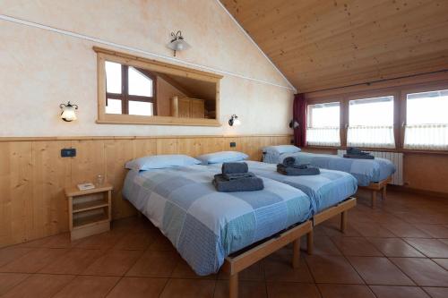 Кровать или кровати в номере La Grolla Rooms & Apartments