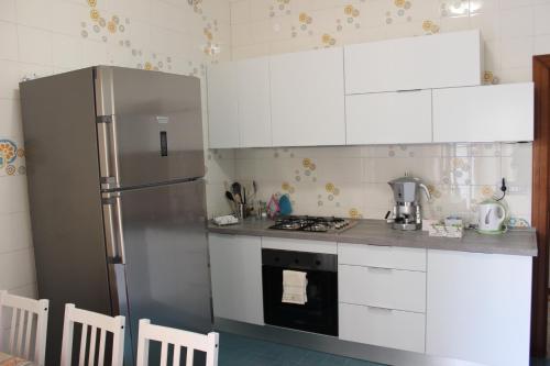 Kuchyň nebo kuchyňský kout v ubytování Maison Flavia