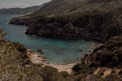 a view of a beach on a mountain at OKU Ibiza in San Antonio
