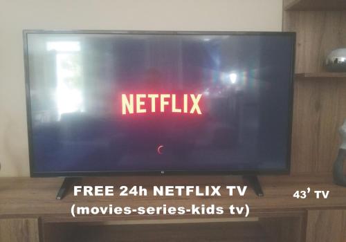 a television screen with the words netflix on it at JK's GUESTHOUSE KARDAMAINA in Kardamaina