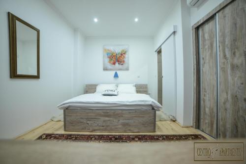 Ένα ή περισσότερα κρεβάτια σε δωμάτιο στο Centro Apartments