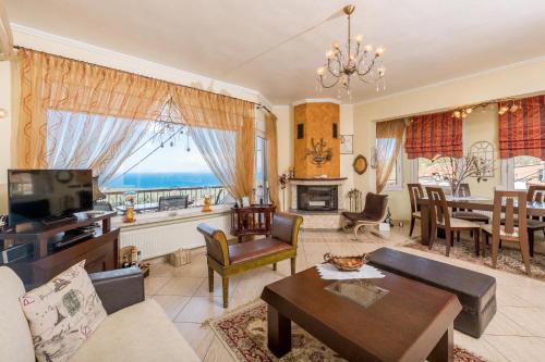 a living room with a couch and a table at Mario's house in Kallirakhi