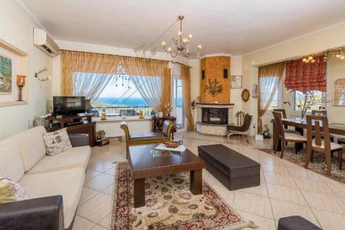 a living room with a couch and a table at Mario's house in Kallirakhi