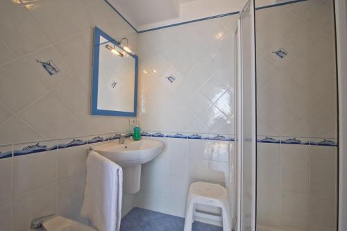 a bathroom with a sink and a shower at casa maia blu in Praiano