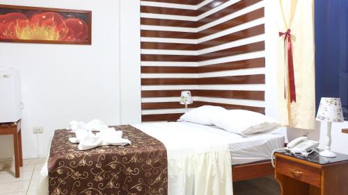 Ένα ή περισσότερα κρεβάτια σε δωμάτιο στο Hotel Rulman