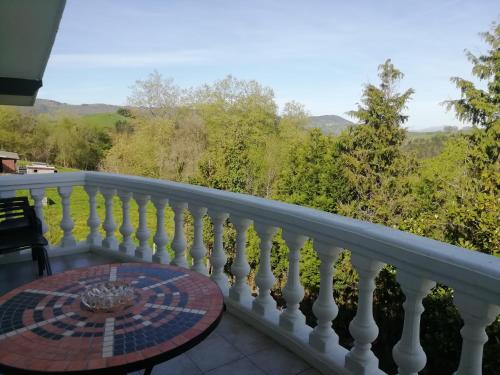 a balcony with a table and a view at Agroturismo Pagoederraga in Orio