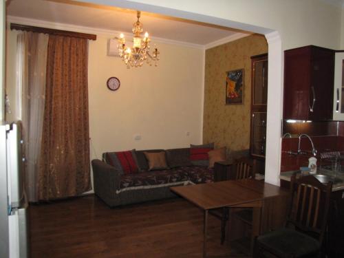 a living room with a couch and a table at agmashenebeli95 in Tbilisi City