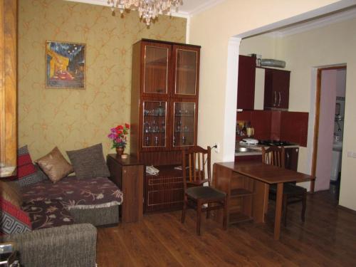 a living room with a couch and a table at agmashenebeli95 in Tbilisi City