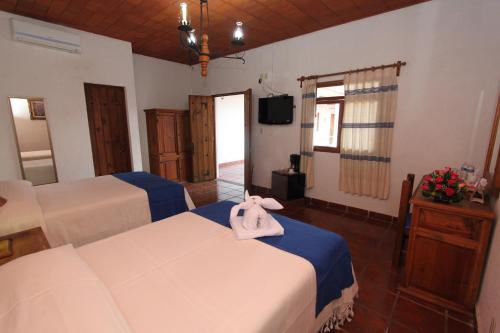 Postelja oz. postelje v sobi nastanitve Parador Monte Carmelo