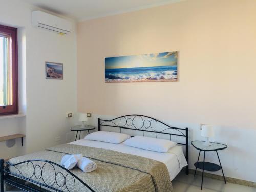 Postel nebo postele na pokoji v ubytování B&B Pizzomunno e Cristalda Rooms