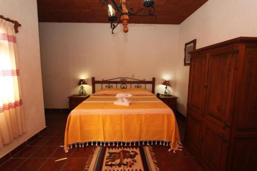 Postelja oz. postelje v sobi nastanitve Parador Monte Carmelo
