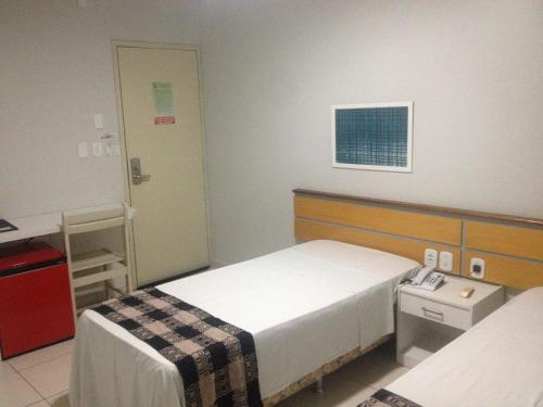 Ένα ή περισσότερα κρεβάτια σε δωμάτιο στο Hotel Sol Nascente