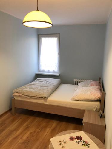 Łóżko lub łóżka w pokoju w obiekcie Apartament Sopot Kraszewskiego