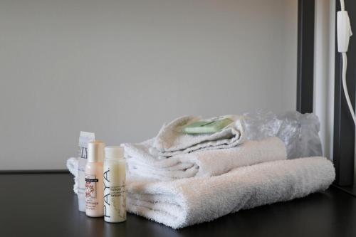 a pile of towels sitting on top of a table at Parkside Student Residence Downtown Toronto in Toronto