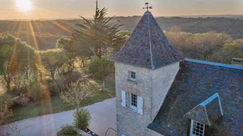 an overhead view of a building with a tower at Domaine La Garenne in Reilhaguet