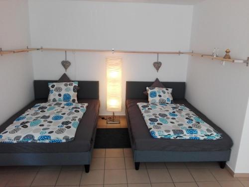 A bed or beds in a room at Borálom Apartman Tokaj