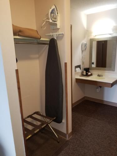 a bathroom with a toilet and a sink at St. Croix Inn in Solon Springs