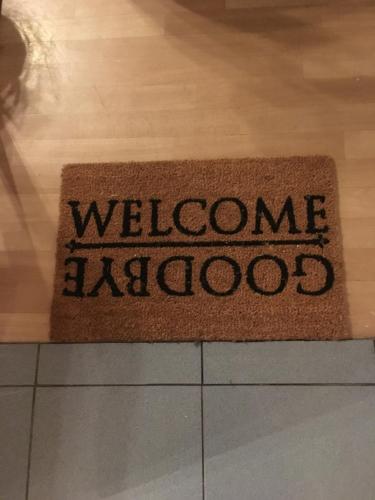 a welcome mat on a floor with the words welcome khalos at Studio Brussels Expo in Brussels