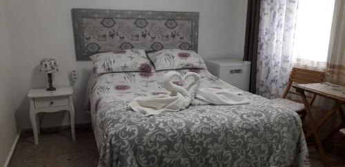 Een bed of bedden in een kamer bij Casa Nadin