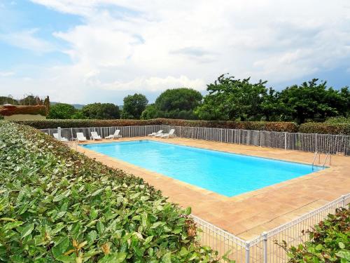 an image of a swimming pool in a garden at Apartment Bonne Terrasse by Interhome in Ramatuelle