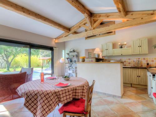 a kitchen and dining room with a table at Holiday Home Bezert by Interhome in Carpentras