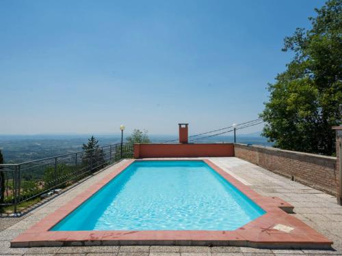 a swimming pool on top of a house at Apartment Il Cipresso by Interhome in San Baronto