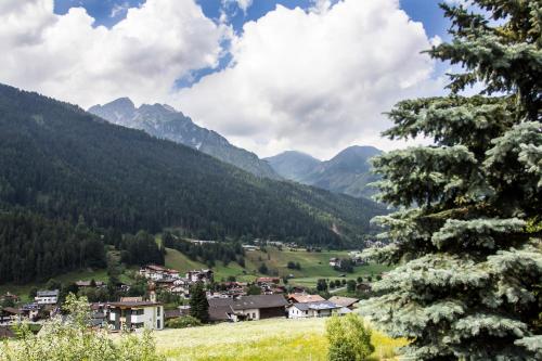 a village in a valley with mountains in the background at Chalet Stubai inklusive Stubai Super Card in Fulpmes
