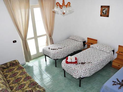 Ένα ή περισσότερα κρεβάτια σε δωμάτιο στο Holiday Home Dea Afrodite by Interhome