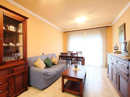 a living room with a couch and a table at Apartment Delicias B by Interhome in Sant Carles de la Ràpita