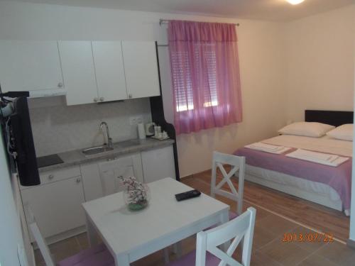 Katil atau katil-katil dalam bilik di Apartments Palma