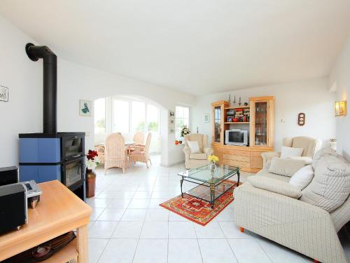 a living room with a couch and a fireplace at Holiday Home B&B by Interhome in Calpe