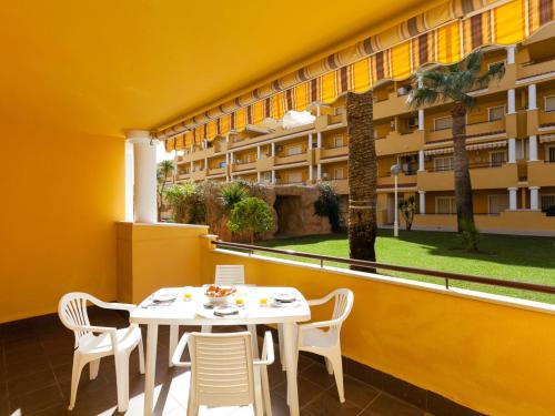 a table and chairs on the balcony of a building at Apartment Cascadas de la Marina-4 by Interhome in Denia