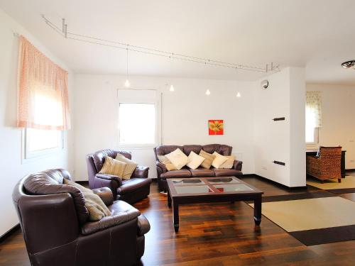 a living room with two couches and a coffee table at Holiday Home Dirk by Interhome in L'Ampolla