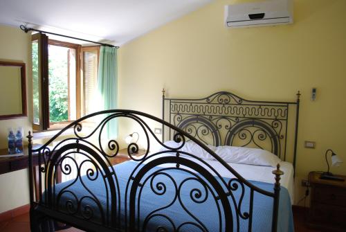 Un pat sau paturi într-o cameră la Locanda I Piceni