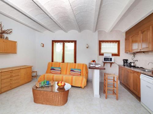 a living room with a bed and a kitchen at Holiday Home Solenza by Interhome in Calonge