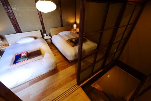 an overhead view of a bedroom with two beds at NIPPONIA HOTEL NARA NARAMACHI in Nara