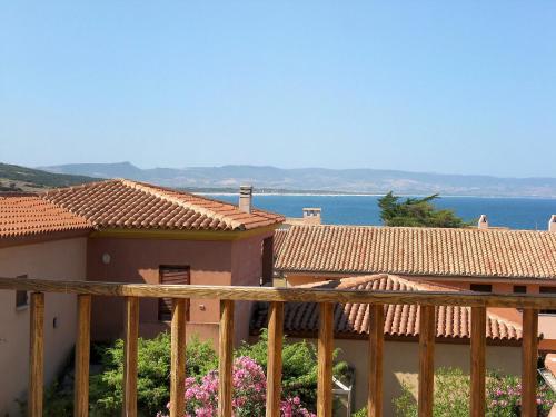 a balcony of a house with a view of the ocean at Apartment Tanca della Torre by Interhome in Isola Rossa