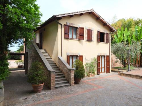 a house with a staircase in front of it at Apartment Montecorneo-5 by Interhome in Montebello