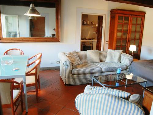 a living room with a couch and a table at Apartment Campo de' Fiori Bright by Interhome in Rome